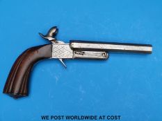 A hammer action pin fire percussion pistol with reeded grips and locks,