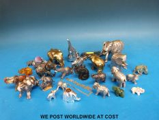 A collection of elephants to include brass,