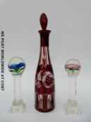 A pair of Murano glass flower paperweights on cut stems and bases (22cm tall) together with a flash
