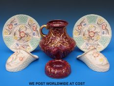 A pair of wall pockets by J Wood Burslem with matching plates,