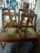 Four oak framed dining chairs