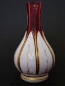 Bohemian overlaid cranberry glass bottle vase with gilt decoration (19.