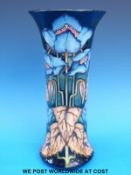 A Moorcroft vase decorated in the meconopsis or blue poppy pattern signed by Philip Gibson to the