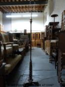 A standard lamp with carved and reeded triform base