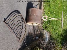 A large wrought iron 16 branch hanging basket holder.