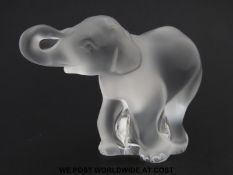 Lalique glass model of a running baby elephant,