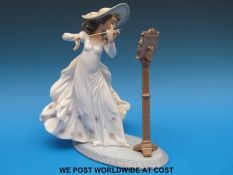 A Lladro figurine of a girl playing a violin (22cm tall)