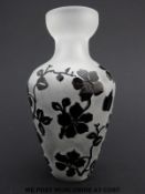 Cameo glass vase decorated with black flowers over a clear frosted ground (12.