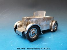 A Dunhill lighter in the form of a vintage MG 'M' type car,