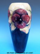 A William Moorcroft vase in Pansy pattern on a blue and pale green ground, 1920's - 1930's,