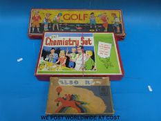 A vintage indoor golf game together with a Chad Valley horse race game and a Kay chemistry set,