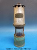 A miner's lamp by J H Naylor