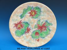 A Royal Doulton charger with water lily design (34cm diameter)