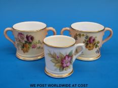 Two Royal Worcester blush ivory loving mugs decorated with flowers together with a miniature Royal