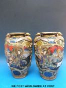 A pair of Japanese vases decorated with court figures with griffin mounts as handles (25.
