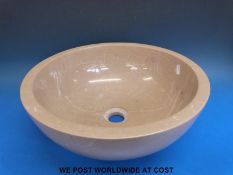 A circular stone sink (diameter 40cm)