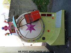 A vintage coin operated 'mini wheel' child's fairground type ride (height approx 240cm)