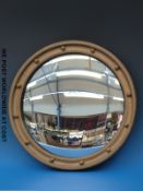A gilt framed convex mirror with applied ball decoration (diameter 46cm)