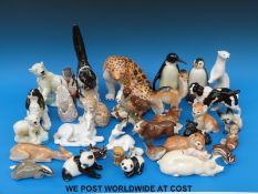 A large collection of ceramic animals to include a Beswick pig and panda, Doulton, Lomonosov/USSR,