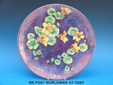 A Royal Doulton charger with nasturtium design (34cm diameter)