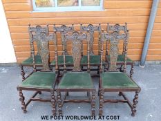 Seven carved oak dining chairs