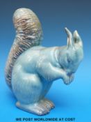 An early Beswick squirrel in blue glaze impressed 315 to base