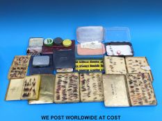 A box containing multiple containers of flies, mainly trout, both wet and dry, cast wallet,