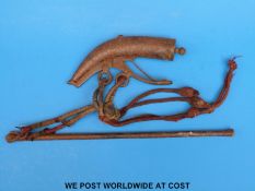 A possibly 19thC military powder flask and ram rod with original lanyard