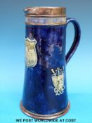 A Royal Doulton silver mounted jug with BSA Shooting Cup decoration,