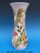 A Moorcroft vase decorated in the William Morris style with golden lilies,