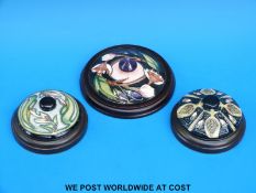 Three Moorcroft paperweights