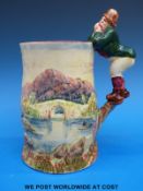A Grimwades Royal Winton musical tankard (movement missing) with figural farmer handle and fishing