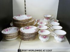 A collection of Royal Doulton tea and dinner ware in Autumn Roses pattern