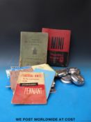 Four knock on spinners complete with spanner together with a collection of car manuals etc to