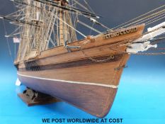 A handmade scale model of the 'Flying Cloud' made in wood with three masts and rigging (length 90cm,