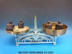 A Titan balance scale with brass pans,
