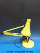 A yellow vintage Anglepoise lamp