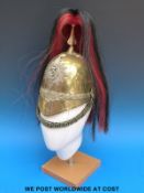 A Victorian 3rd Dragoon Guards brass helmet with plume and chin strap