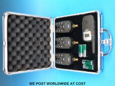 A cased set of three Fladen bite alarms,