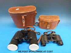 A pair of Carl Zeiss 6x24 binoculars and a pair of Snow- man 12x50 binoculars both in leather cases