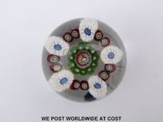 Clichy patterned millefiori glass paperweight with central signature pink,