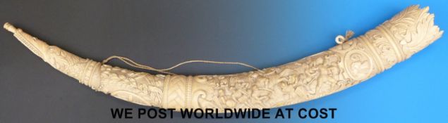 A Southern German intricately designed 19thC elephant's tusk imitating a hunting horn,