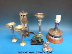 A miner's lamp together with an Imp-Press stamping machine,