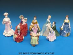 A group of eight Royal Doulton and Royal Worcester figurines