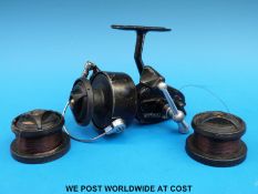 A boxed Mitchell 400 fishing reel with two spare spools