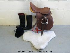 An English leather saddlery rack, numnah,