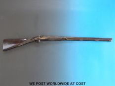 An English single barrelled muzzle loading shotgun with chequered grip and chequered horn tipped