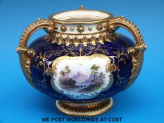 A Coalport pedestal bowl all over gilt decorated with birds and flowers,