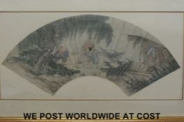 A framed Oriental fan in gilt frame