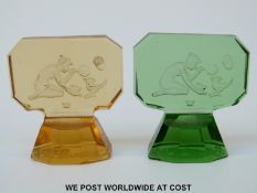 Two Baccarat glass paperweights both engraved with scenes of a girl blowing bubbles towards a bird,